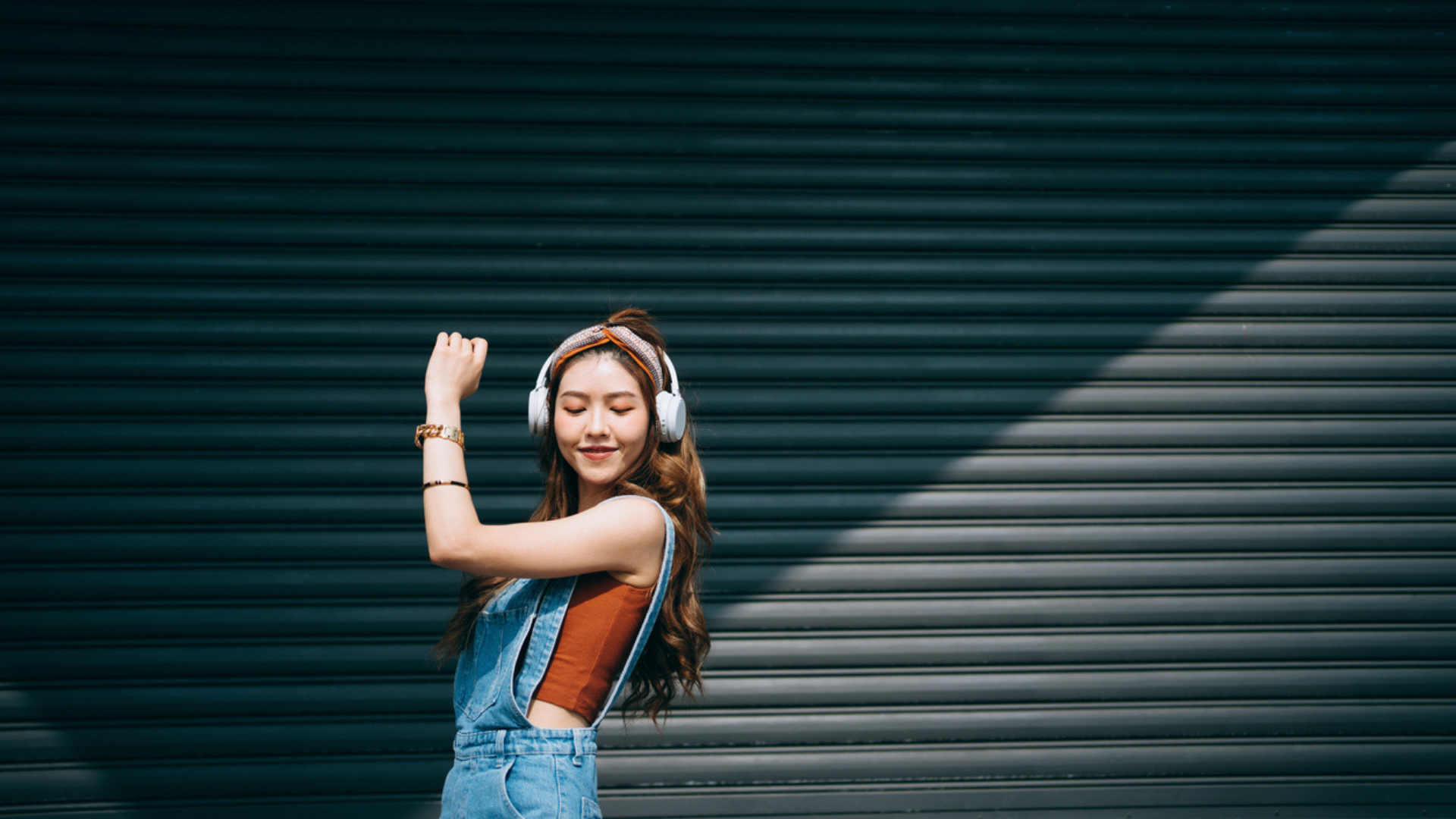 Female college student flexes her muscles and shows health benefits